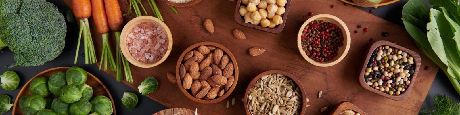 Different vegetables, seeds and fruits on table. Healthy diet.
vegetarian, vegan food cooking ingredients. Flat-lay of vegetables, fruit, beans, cereals, kitchen utencil, dried flowers, top view.